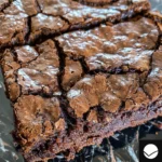 Close-up shot of a cracked and fudgy brownie.