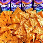 Twelve bags of Doritos in three flavors: Cool Ranch, Sweet Chili, and Rainbow.