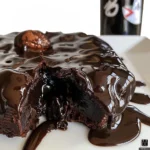 A 240g dark chocolate Easter egg filled with dark chocolate wafer pieces, shown whole and broken open.