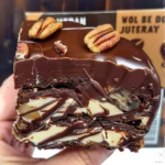 Outback Chokkie chocolate egg, a dark chocolate egg with white chocolate drizzled on top, next to its packaging.