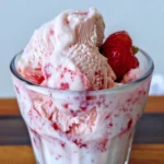 Creamy strawberry ice cream in a glass.